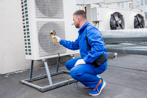 istock Technician uses a thermal imaging infrared thermometer to check the condensing unit heat exchanger. 1318863587