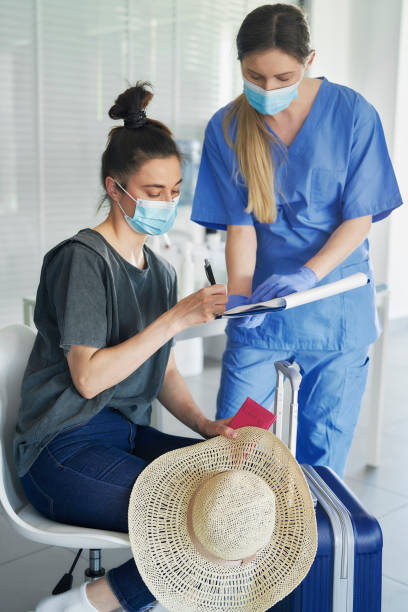 istock Woman signs documents before travel 1318864124