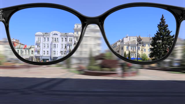 sharpness with glasses walking around the city