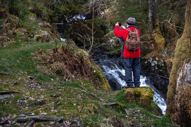 istock Retired man taking a photograph with his phone 1318864933