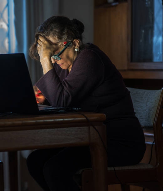 istock Senior Hispanic woman on laptop 1318866015