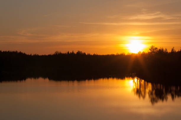 istock bright sunset over the lake 1318870062
