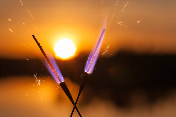 istock lights and sparks on sunset background 1318870103