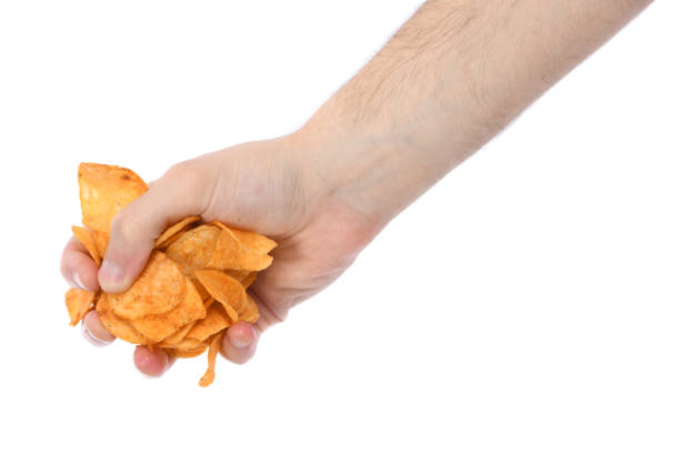 istock Male hand holding potato chips 1318870283