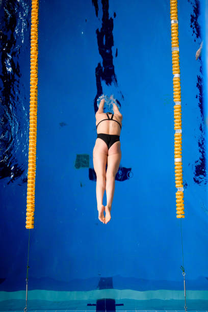 istock male professional competitive swimmer in swimming pool 1318874401