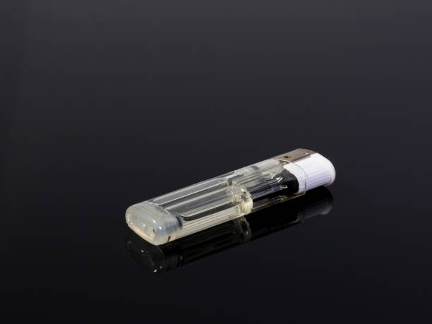 istock A white gas lighter on a black and gray reflecting background 1318874419
