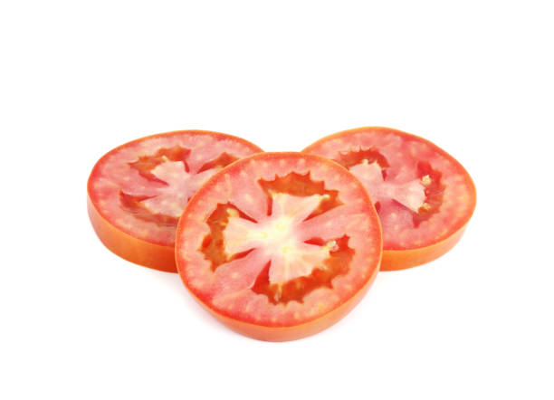 istock Tomato sliced isolated on white background 1318876606