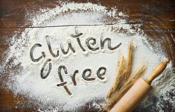 istock Baking background with the rolling pin, wheat and flour on the wooden table 1318876934