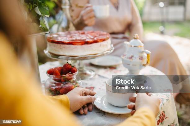 Woman Holding A Teacup On The Garden Table Stock Photo - Download Image Now - Afternoon Tea, Tea Party, Women