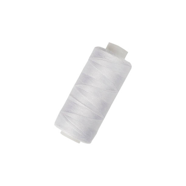 istock Close up of a spool of white sewing thread on a white isolated background. Thread is a type of yarn that is also used for sewing. Made from cotton, wool, linen, nylon and silk. 1318879514