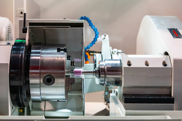 3 jaws chuck during holding clear plastic cylinder or workpiece set on high precision automatic cnc grinder machine for inside diameter or hole grinding of manufacturing finishing process