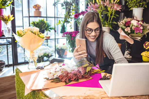 istock Female gardener noting client order during mobile phone conversation 1318886748