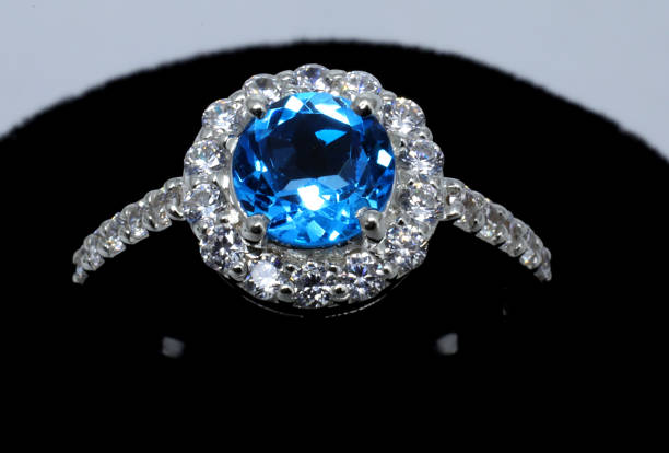 istock Gold ring with blue and white gem 1318887823