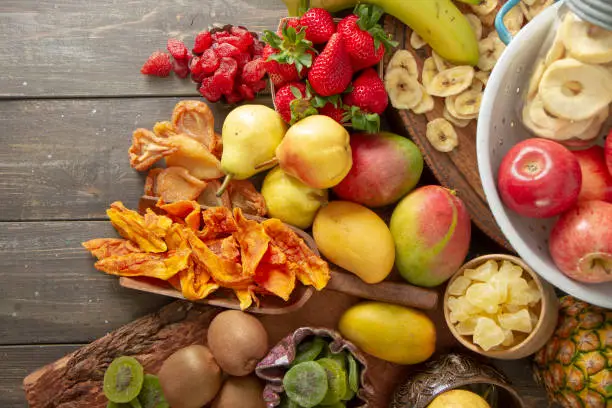 Fresh fruit with the dried version of the same fruit.