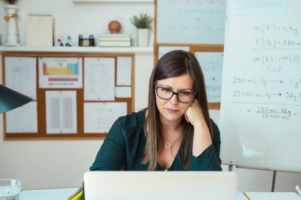 istock Female Professor Holding Online Class for E-learning Students During Pandemic 1318894515