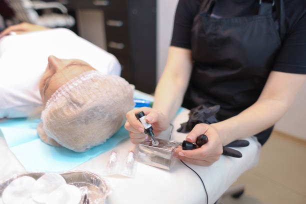 istock tattoo artist makes permanent eyebrow makeup procedure 1318896106