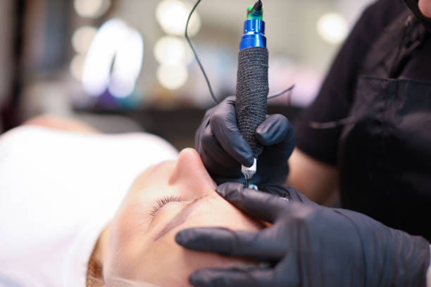 istock tattoo artist makes permanent eyebrow makeup procedure 1318896151