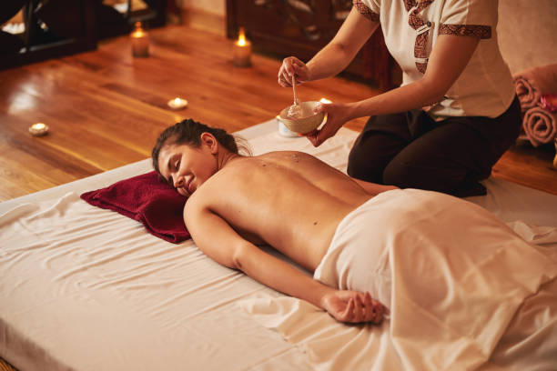istock Massage parlour specialist getting cream with stick from deep plate 1318897046