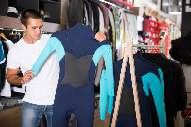 istock Young male chooses sportswear 1318898056