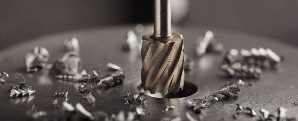 istock Milling cutter make sink in hole in steel billet. Locksmith work. 1318903319