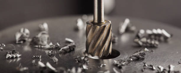 Milling cutter make sink in hole in steel billet. Locksmith work. Milling cutter make sink in hole in steel billet. Locksmith work. metal worker stock pictures, royalty-free photos & images