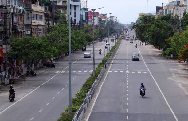 Coronavirus outbreak in India Few vehicles are seen in a road, due to rise of COVID-19 coronavirus cases, in Guwahati, India on 17 May 2021. guwahati stock pictures, royalty-free photos & images