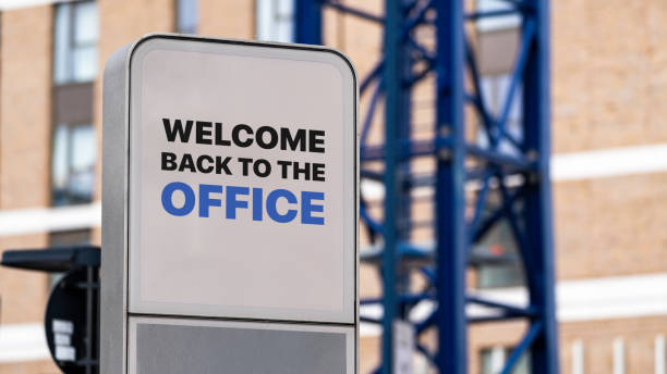 istock Welcome Back to the Office sign in a city setting under construction 1318905406