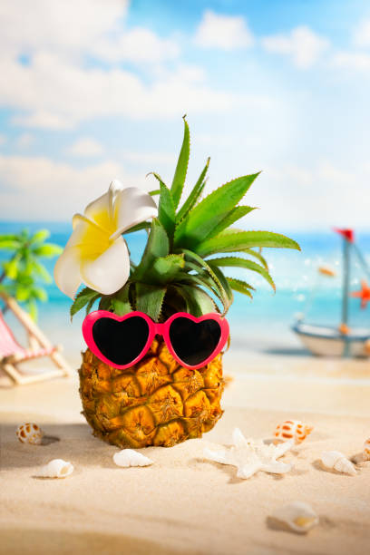 istock Pineapple with sunglasses in heart form 1318905616
