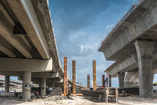 Construction of a new viaduct next to an old one to improve traffic in the city.