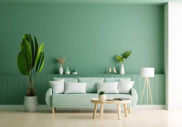 istock Green sofa in green living room with copy space, 3D rendering 1318908669
