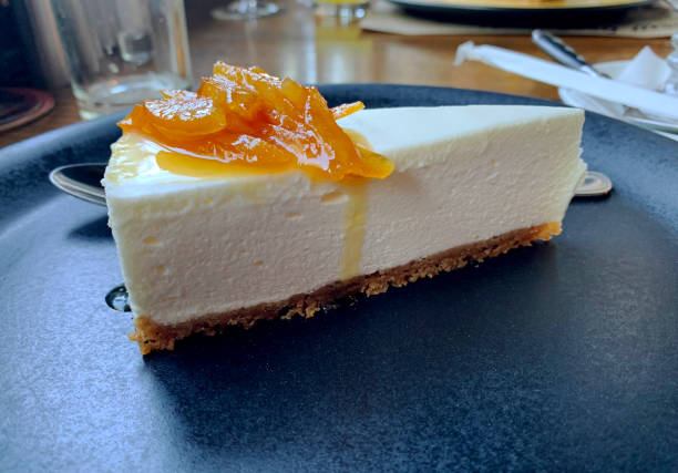 istock Cheesecake with jelly on a blue plate. Restaurant view. 1318910986