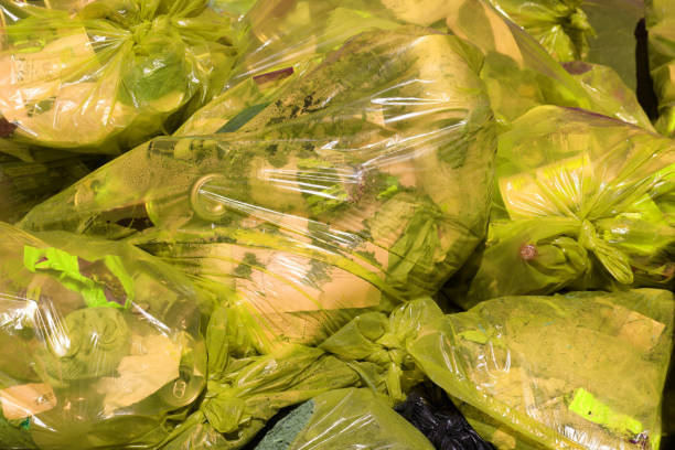istock full frame background of yellow plastic trash bags with generic domestic waste 1318912764