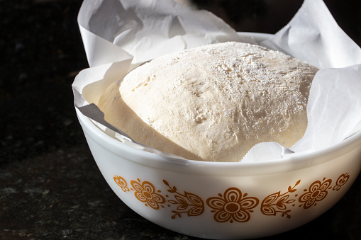 Sourdough dough fermenting in a bowl to make a loaf of bread