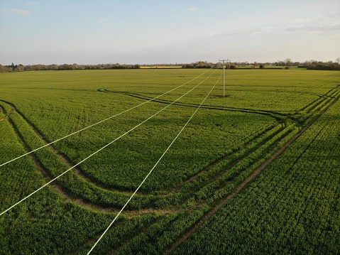 High angle view of telegraph wires in field