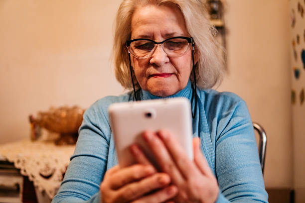 istock Senior woman using a tablet at home 1318918824