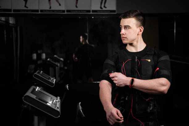 istock EMS suit with red wires for electro impulse stimulation for body. Training in GYM. 1318921021
