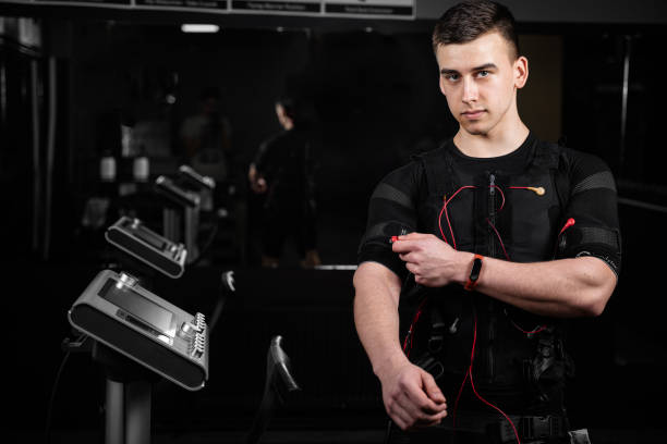 istock EMS suit with red wires for electro impulse stimulation for body. Training in GYM. 1318921052