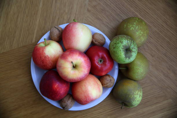 istock Top view of red apples, rennet apples and walnuts 1318923201