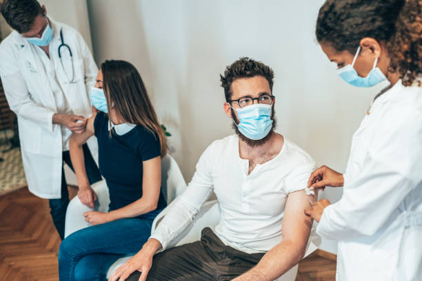 istock Doctors giving vaccine 1318925688