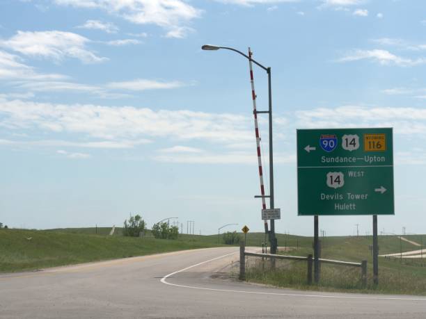 istock Road intersection with directions to Sundance, Devils Tower and Hulett, Wyoming. 1318925698