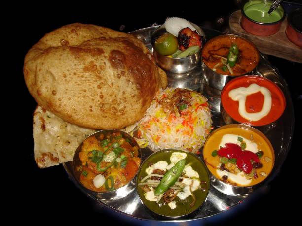 istock Full Indian meal with assorted appetizers and naan bread. 1318925954
