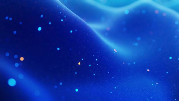 istock fantastical festive blue bg. Stylish abstract background, waves on matt surface like landscape made of liquid blue wax with sparkles. Beautiful soft background. 3d render 1318926965