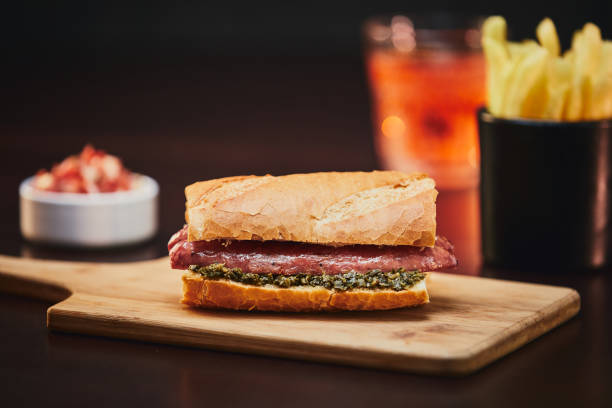 Argentinian choripan with chimichurri. Argentinian choripan with chimichurri. chimichurri stock pictures, royalty-free photos & images