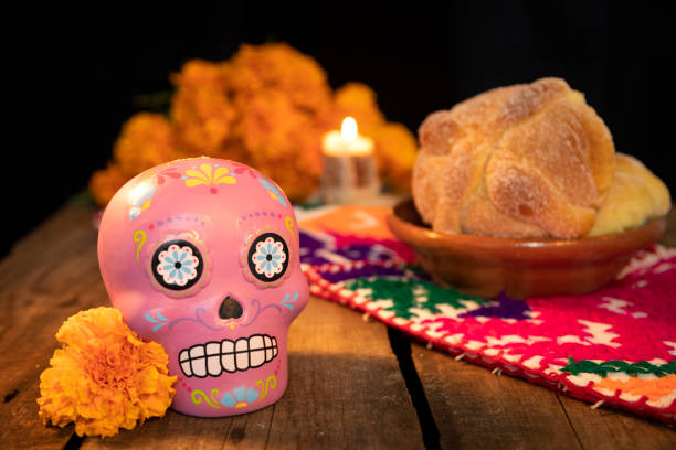 istock typical Mexican skull and cempazuchitl flowers on white background. 1318928163