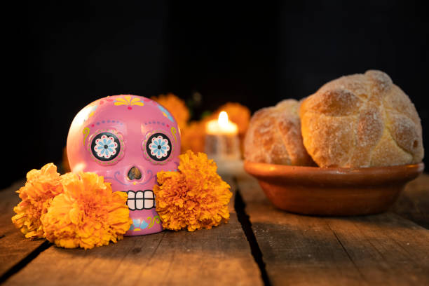 istock typical Mexican skull and cempazuchitl flowers on white background. 1318928164