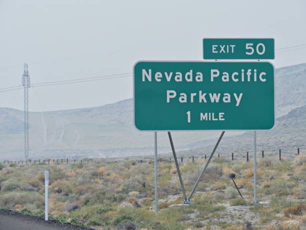 istock Roadside sign at Interstate 80 with exit and direction to Nevada Pacific Parkway. 1318929948