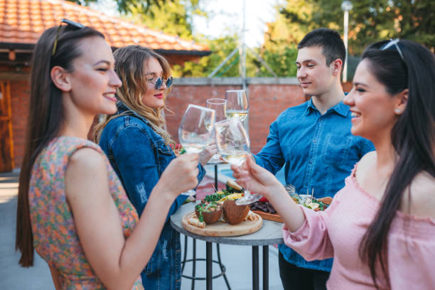 istock Friends drinking wine at the pool! 1318934395