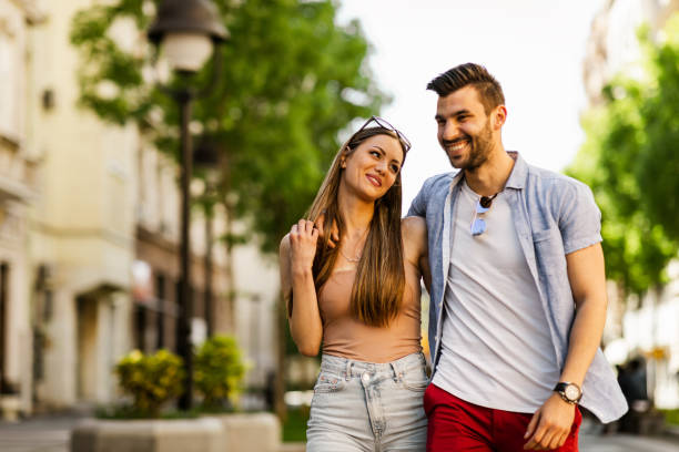 istock Happy young couple outdoors on sunny day 1318934984