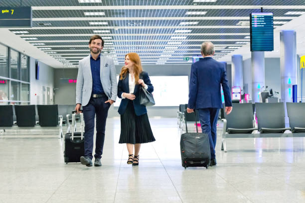 istock Confident business colleagues at airport terminal 1318935383