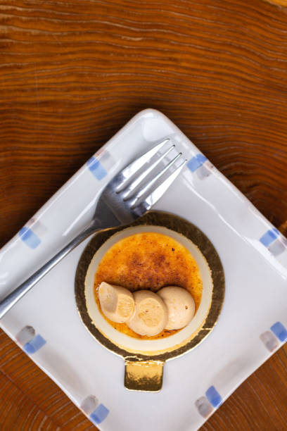 istock Creme brulee mini cheesecake tart on small plate 1318936033